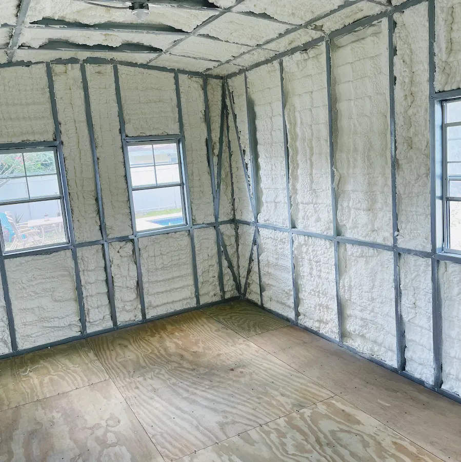 Closed-cell spray foam insulation applied to wall cavities in a residential project in Corinth